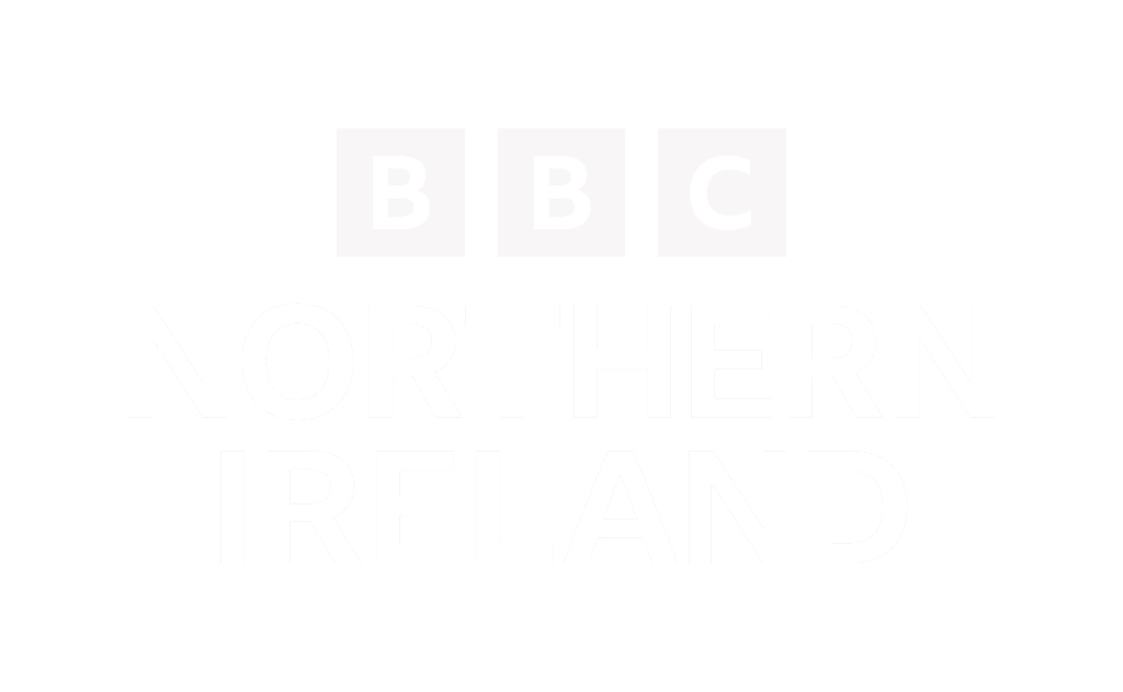 BBC Northern Ireland logo features "BBC" in three white squares above the words "Northern Ireland" in bold white capital letters on a transparent background.