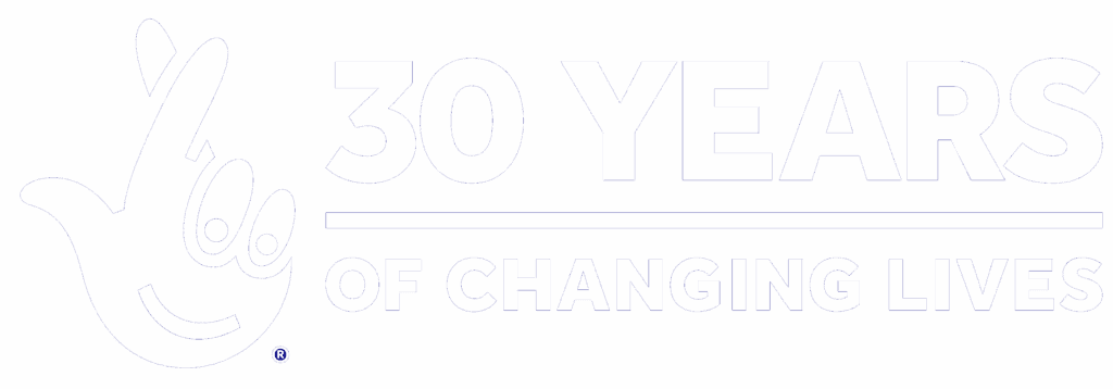 White text on blue background reads "30 Years of Changing Lives" with a stylized crossed fingers logo on the left.
